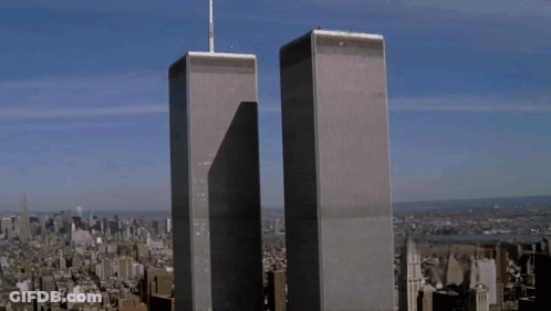 The Twin Towers Of The World Trade Center Are Shown GIF