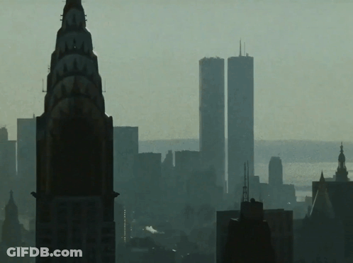 The Twin Towers Of The World Trade Center Are Visible In The Background GIF