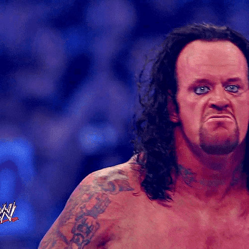 The Undertaker Angrily Grinning GIF