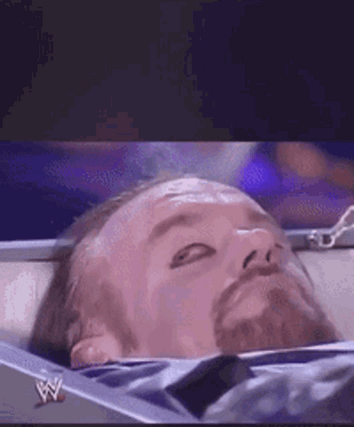 The Undertaker Lying On Coffin GIF