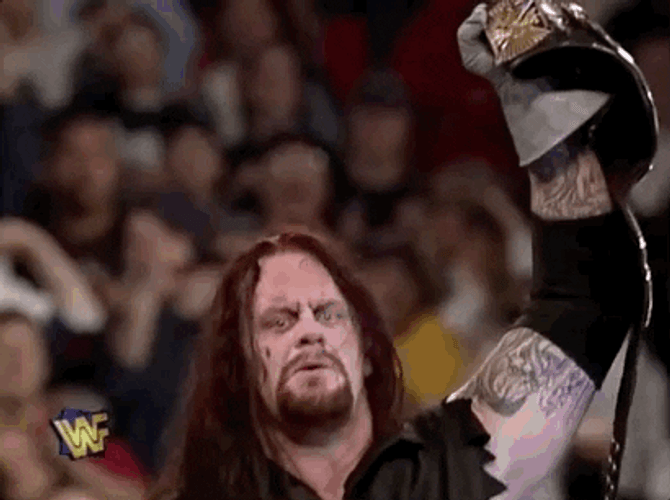 The Undertaker Raising Belt GIF