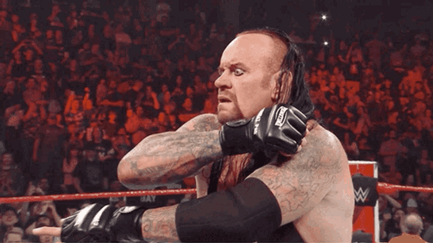The Undertaker Sticking Out His Tongue GIF