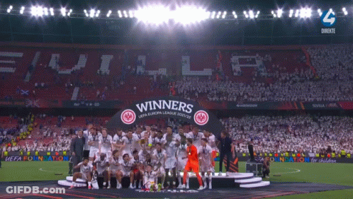 The Winners Of The Uefa Europa League Celebrate On A Stage GIF