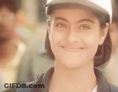 The Woman Is Wearing A Baseball Cap And Smiling . GIF