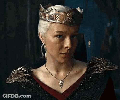The Woman Is Wearing A Crown And A Necklace . GIF