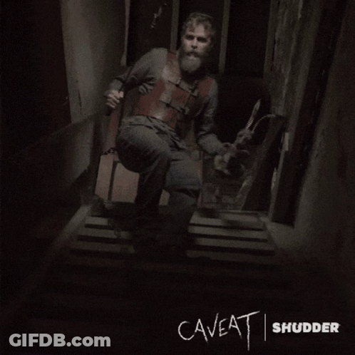 The Word Caveat Is Written On A Wall In A Dark Room GIF
