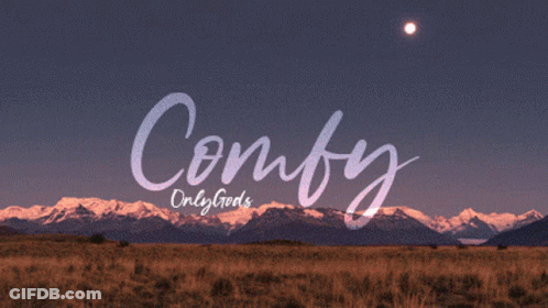 The Word Comfy Is On A Sunset Background GIF