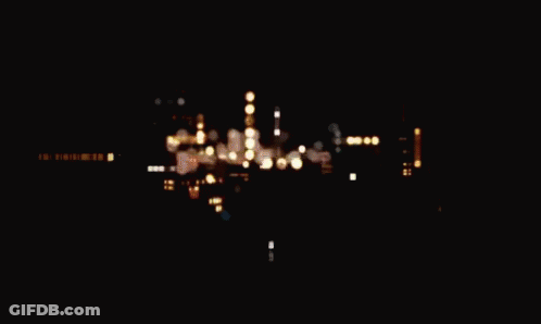 The Word Graphic Is Displayed On A Dark Brown Background GIF
