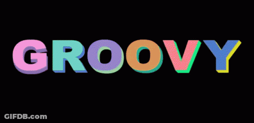 The Word Groovy Is Written In Colorful Letters Against A Black Background GIF