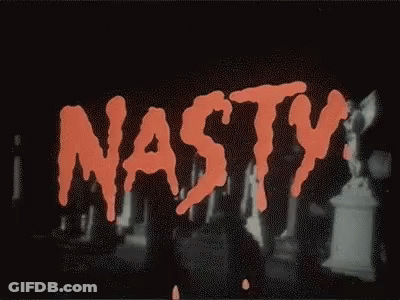 The Word Nasty Is Written In Red On A Black Background In A Cemetery . GIF