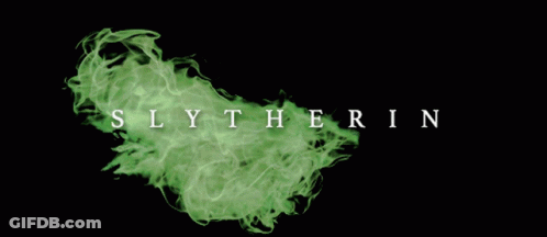 The Word Slytherin Is Surrounded By Green Smoke On A Black Background GIF