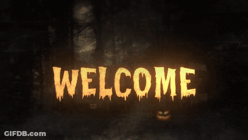 The Word Welcome Is Glowing In The Dark Surrounded By Pumpkins GIF