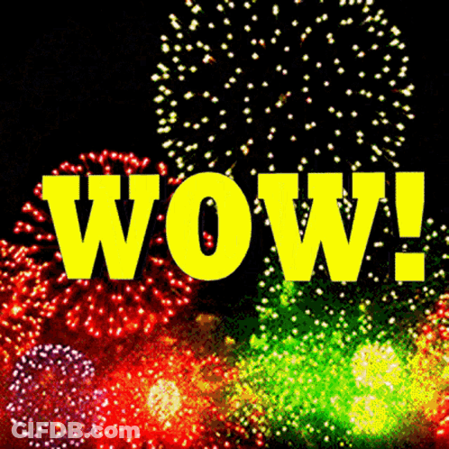 The Word Wow Is Surrounded By Fireworks In The Sky GIF
