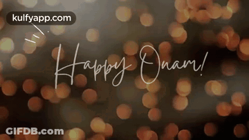 The Words Happy Onam Are Written In Cursive On A Blurry Background . GIF