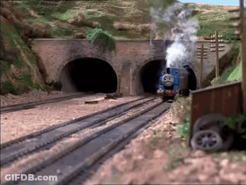 Thomas The Train Is Going Through A Tunnel And Smoke Is Coming Out Of It GIF