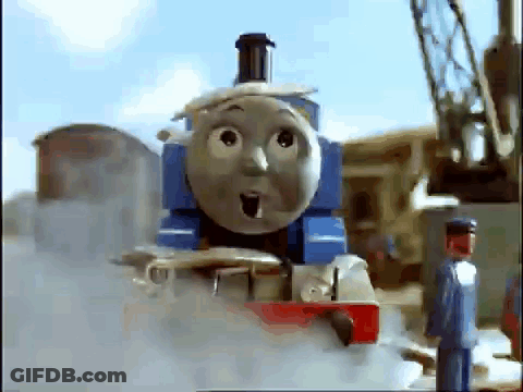 Thomas The Train Is Making A Surprised Face While A Man Stands Next To It . GIF