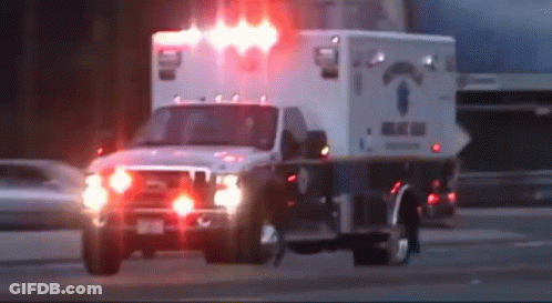 Three Ambulance Vans Parked With License Plate Starting Z GIF