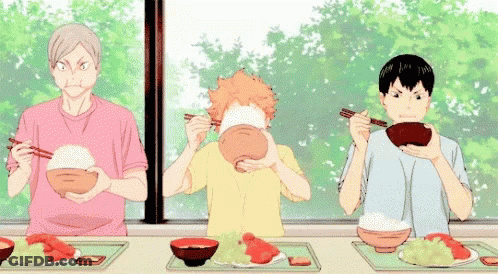 Three Anime Characters Are Sitting At A Table Eating Food . GIF