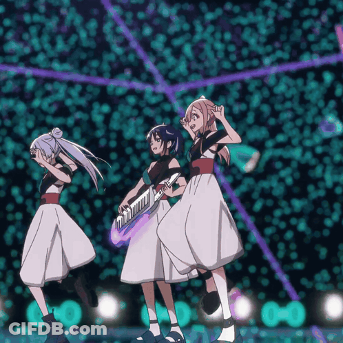 Three Anime Girls Are Dancing On A Stage And One Is Holding A Piano GIF