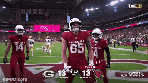 Three Arizona Football Players Celebrate A Touchdown During A Game GIF