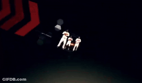 Three Baseball Players Are Standing In Front Of A Sign That Says ' Cardinals ' GIF