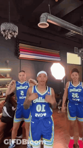 Three Basketball Players In Blue Uniforms Number 10 GIF