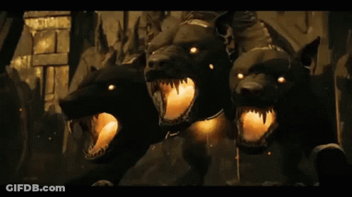 Three Black Dogs With Glowing Eyes Mouths Open GIF