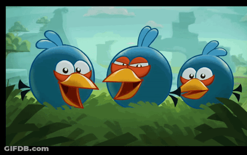 Three Blue Birds With Orange Beaks Standing In Grass GIF