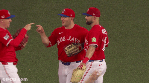 Three Blue Jays Baseball Players Huddled Together GIF