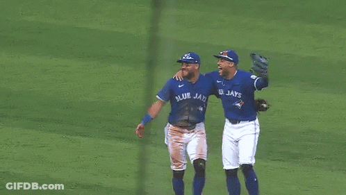 Three Blue Jays Baseball Players Hugging GIF
