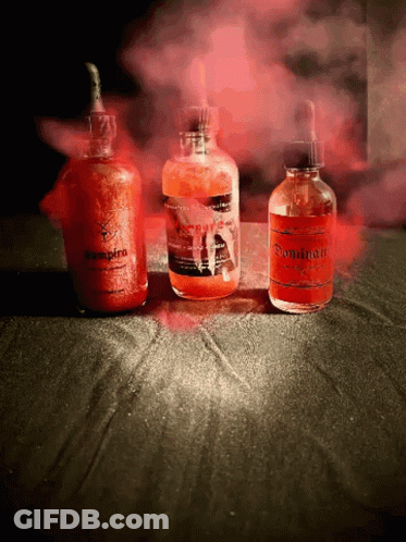 Three Bottles Of Liquid One Of Which Is Called Vampire GIF