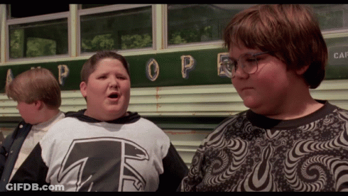 Three Boys Are Standing In Front Of A Bus With The Word Pope On It GIF