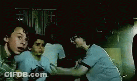 Three Boys Fighting In Dark Room GIF