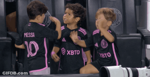 Three Boys In Black And Pink Jerseys Number 10 GIF