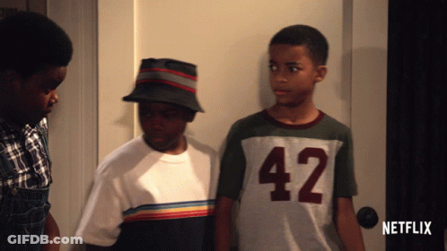 Three Boys Standing In Front Of Netflix Door GIF
