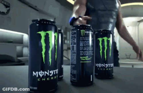 Three Cans Of Monster Energy Drink Are On A Counter GIF