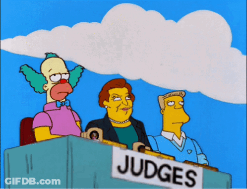 Three Cartoon Characters Sit Behind A Sign That Says " Judges " GIF
