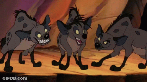 Three Cartoon Hyenas Are Standing Next To Each Other On A Rock GIF