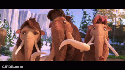 Three Cartoon Mammoths Are Standing Next To Each Other In A Snowy Landscape GIF
