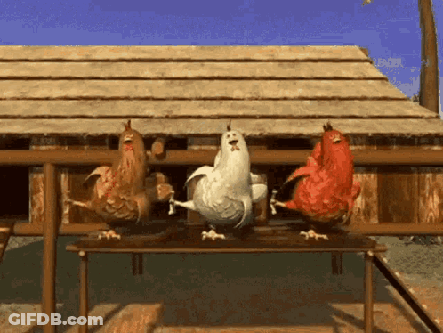 Three Chickens Standing On Table GIF