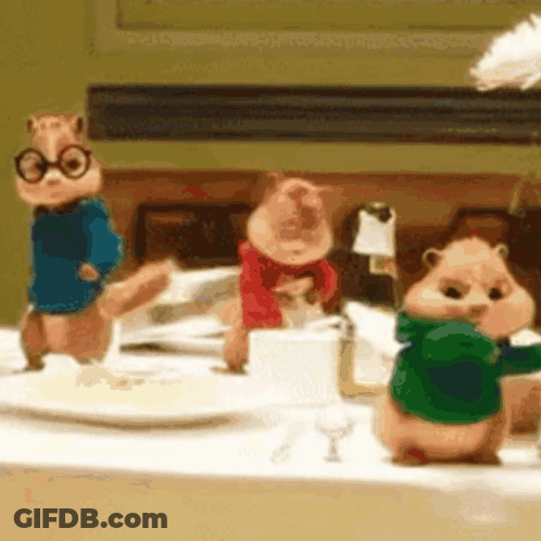 Three Chipmunks Standing On Table GIF