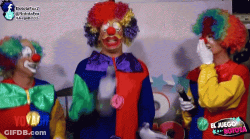 Three Clowns In Front Of El Juego Botola Sign GIF