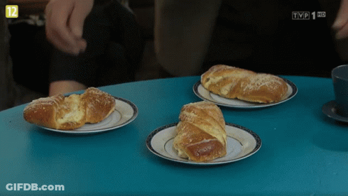 Three Croissants On Plates With TVP Logo GIF