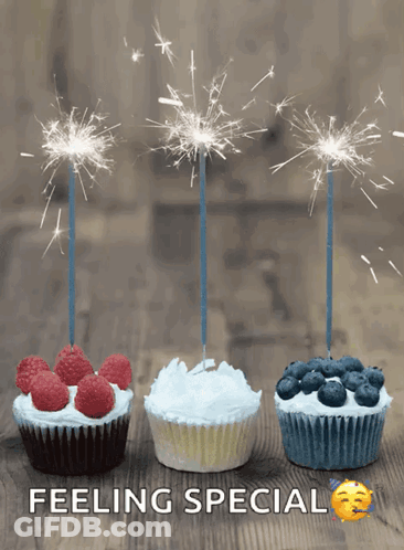 Three Cupcakes With Sparklers On Them And The Words Feeling Special GIF