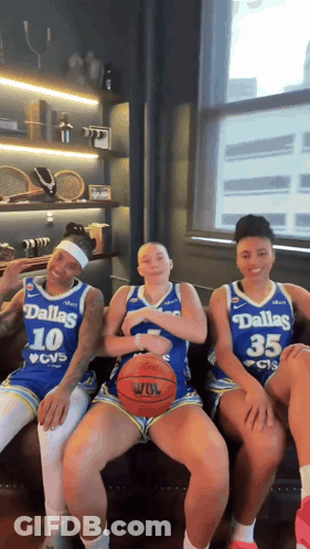 Three Dallas Basketball Players Sitting On Bench GIF