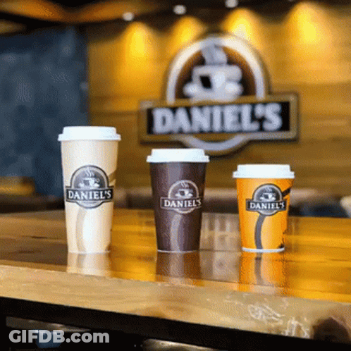Three Daniel's Coffee Cups In Front Of Daniel's Sign GIF