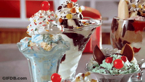 Three Different Ice Cream Sundaes Are On A Table GIF