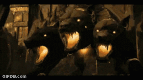 Three Dogs With Glowing Eyes In Dark Room GIF