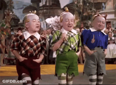 Three Dwarfs From The Wizard Of Oz Standing GIF