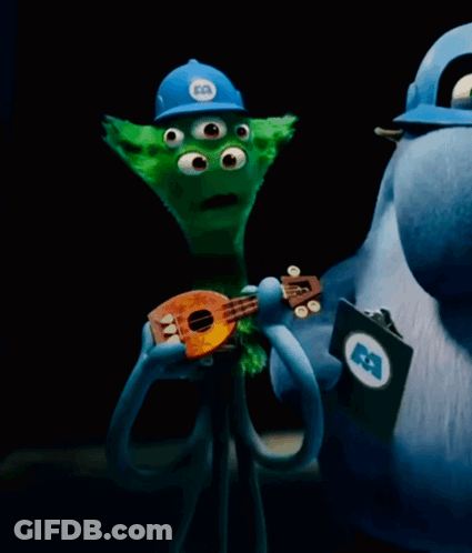 Three-Eyed Cartoon Character Holding Guitar GIF